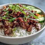 Ready in 25 minutes, topped with fresh carrots, cucumbers, and green onions.