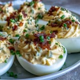 Tangy sweet pickle relish deviled eggs, a vibrant appetizer with a zesty kick.